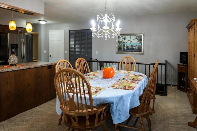 carpeted dining space with an inviting chandelier