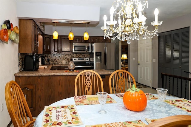 dining area with a notable chandelier