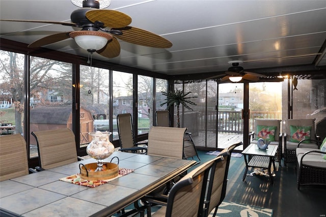 sunroom / solarium with ceiling fan and a wealth of natural light