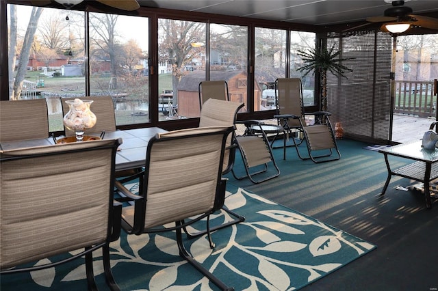 sunroom / solarium with ceiling fan and a wealth of natural light