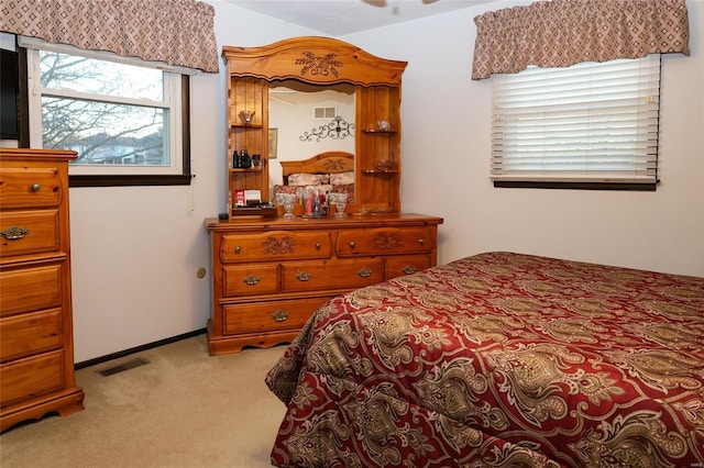 bedroom featuring light colored carpet