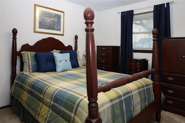 bedroom featuring light carpet