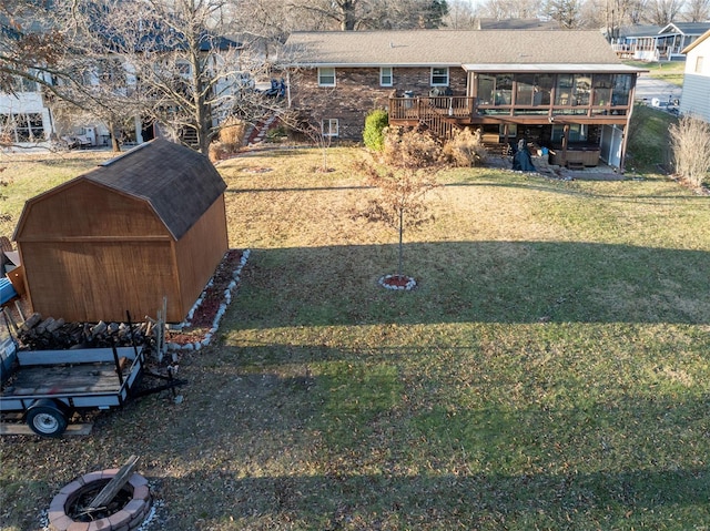 view of yard with a wooden deck and a sunroom