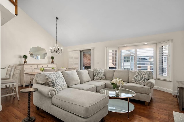 living room with dark hardwood / wood-style flooring, an inviting chandelier, and vaulted ceiling