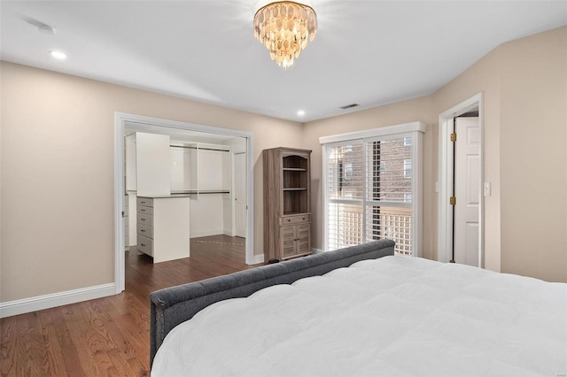 bedroom featuring dark wood-type flooring and a closet