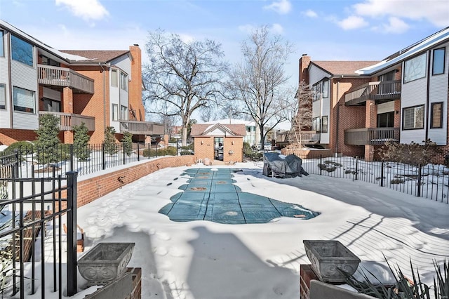 view of snow covered pool