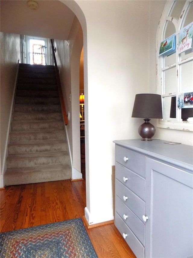 staircase featuring hardwood / wood-style floors