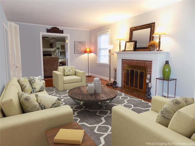 living room with crown molding and a brick fireplace