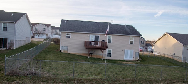 rear view of property with a lawn