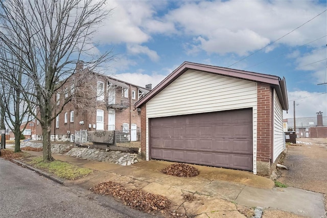 view of front facade with an outbuilding and a garage