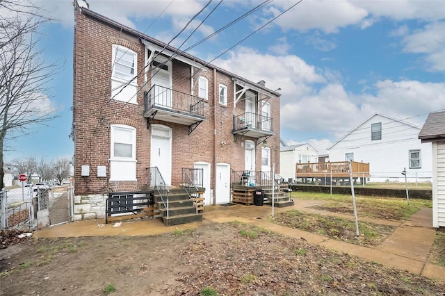 rear view of house featuring a balcony