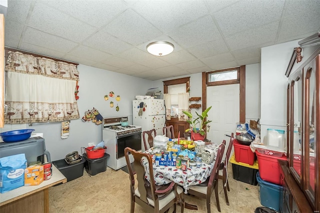 dining area with a paneled ceiling