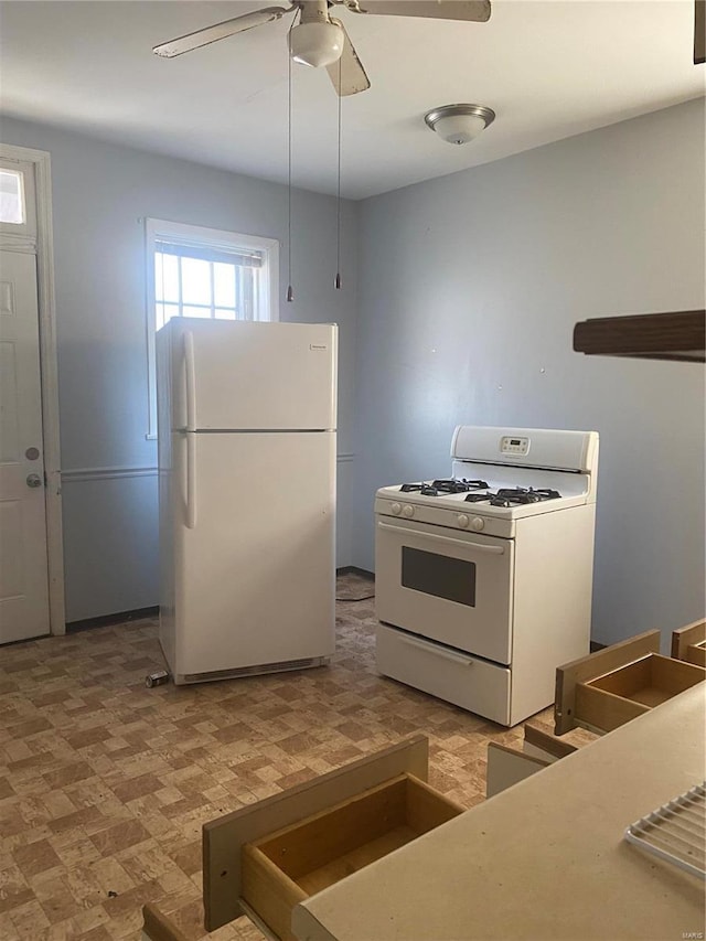 kitchen featuring ceiling fan and white appliances