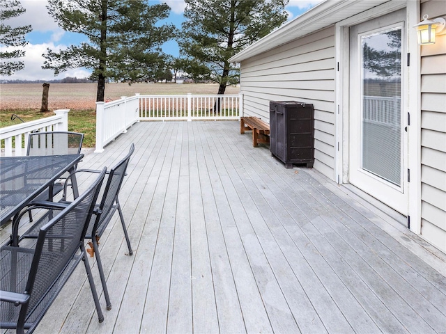 wooden deck featuring a rural view