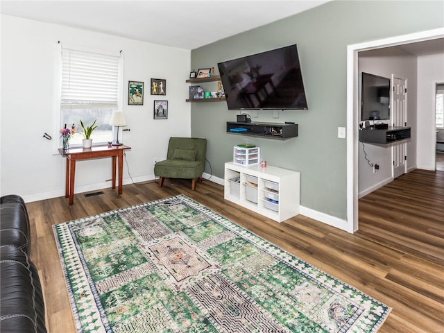 living room featuring dark hardwood / wood-style floors