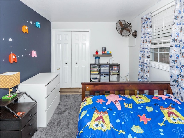 carpeted bedroom with a closet