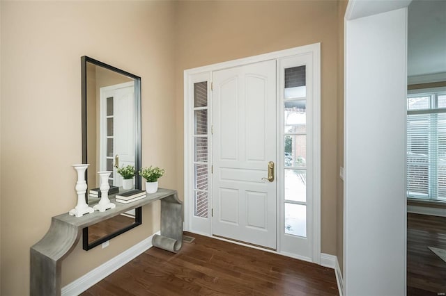 entrance foyer featuring dark wood-style floors and baseboards