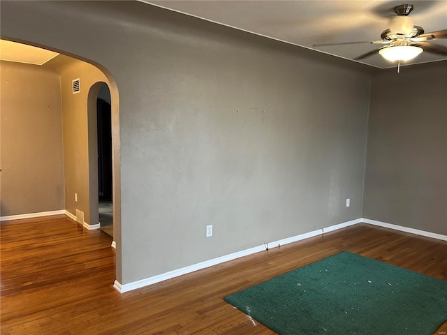 unfurnished room with hardwood / wood-style flooring and ceiling fan