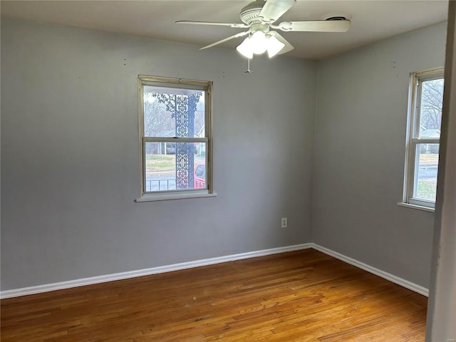 spare room with ceiling fan and light hardwood / wood-style floors