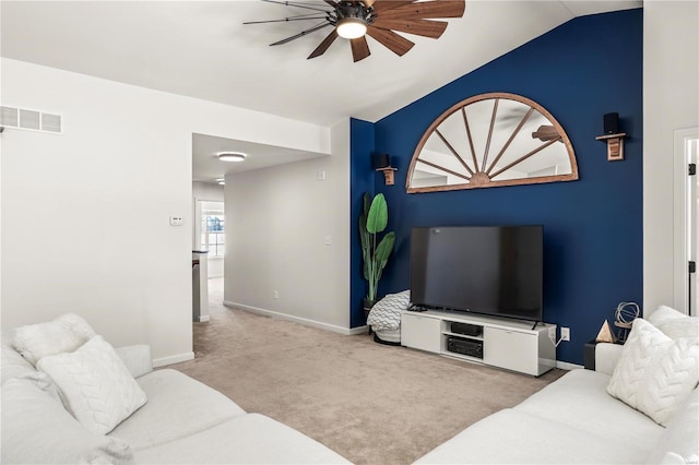 carpeted living room featuring ceiling fan and lofted ceiling