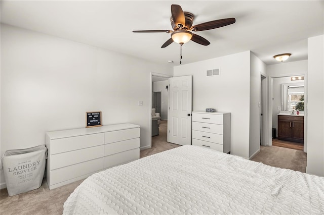 carpeted bedroom featuring ceiling fan and connected bathroom