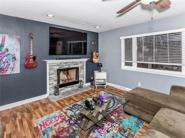 living room featuring a fireplace and wood-type flooring