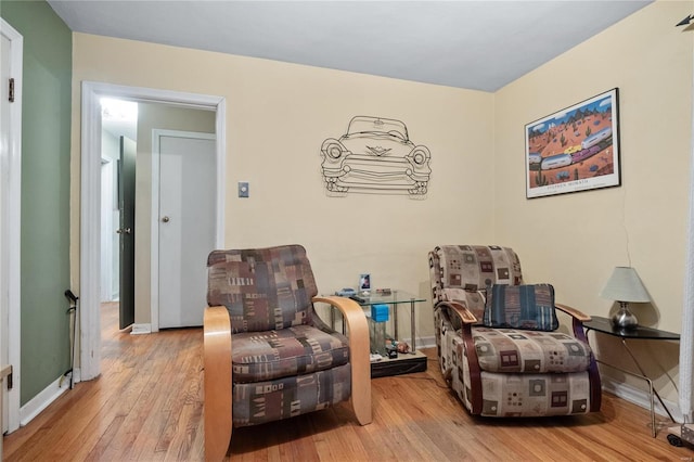 sitting room with light hardwood / wood-style floors