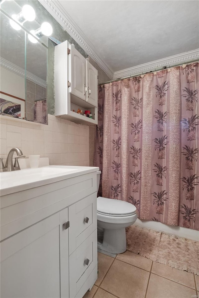 bathroom featuring vanity, tile patterned flooring, decorative backsplash, toilet, and ornamental molding