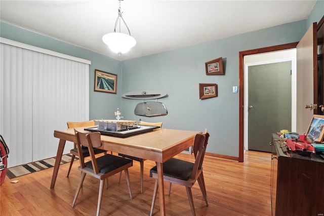 dining area with light wood-type flooring