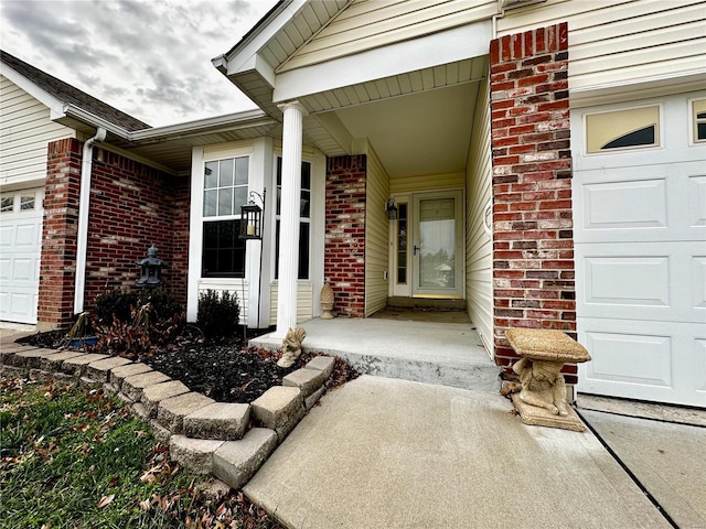 view of exterior entry featuring a garage