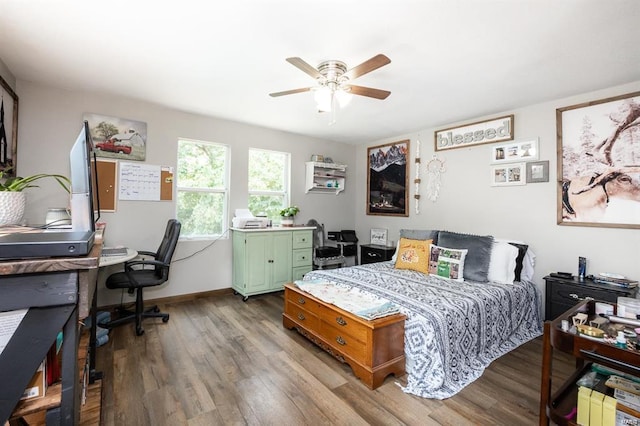 bedroom featuring hardwood / wood-style floors and ceiling fan