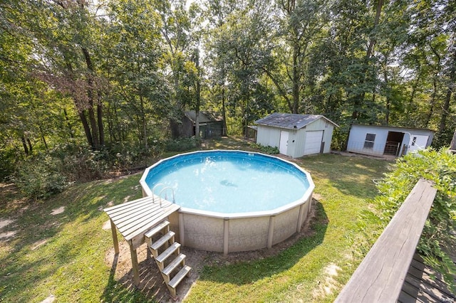 view of pool with an outdoor structure and a yard