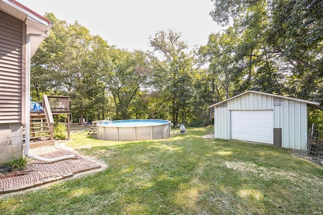 view of yard with a swimming pool side deck and an outdoor structure