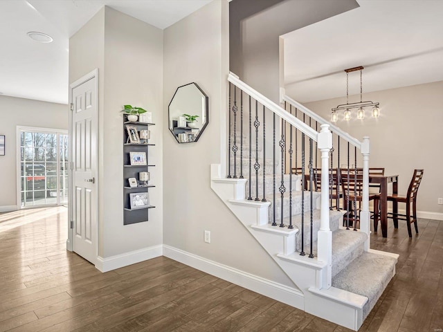 stairs featuring wood-type flooring