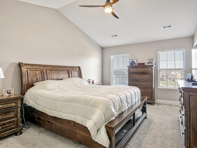 carpeted bedroom featuring vaulted ceiling and ceiling fan