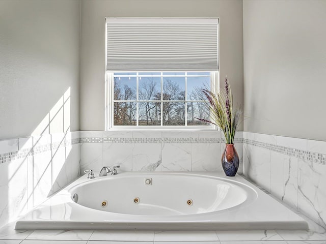 bathroom with tiled tub