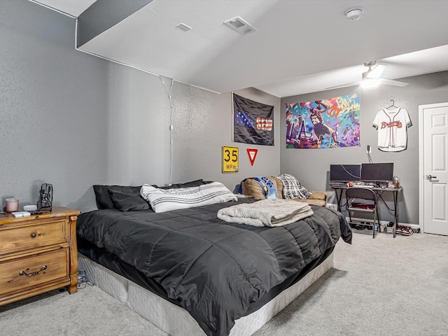 bedroom with ceiling fan and light carpet