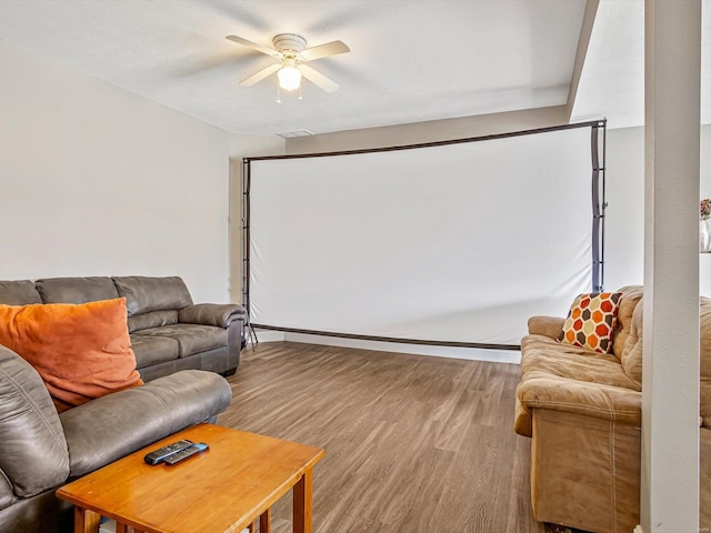 living room featuring hardwood / wood-style floors and ceiling fan