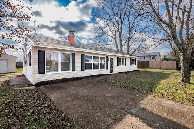 rear view of property featuring a yard