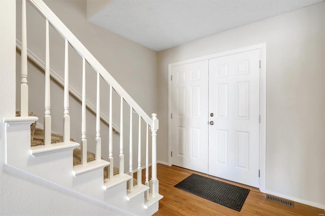 entrance foyer with wood-type flooring