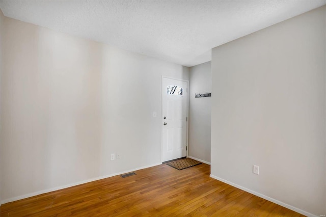 empty room featuring hardwood / wood-style floors