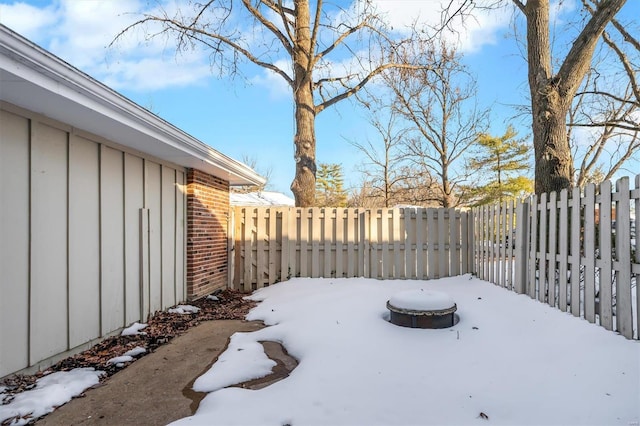 view of yard layered in snow