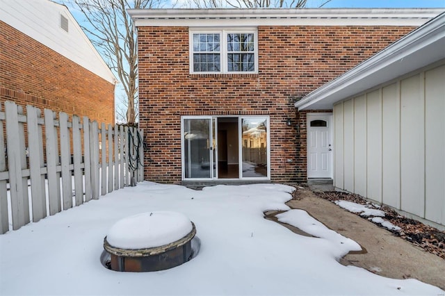 view of snow covered house