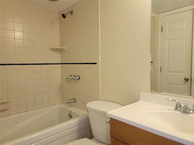 bathroom with toilet, vanity, and shower / tub combination