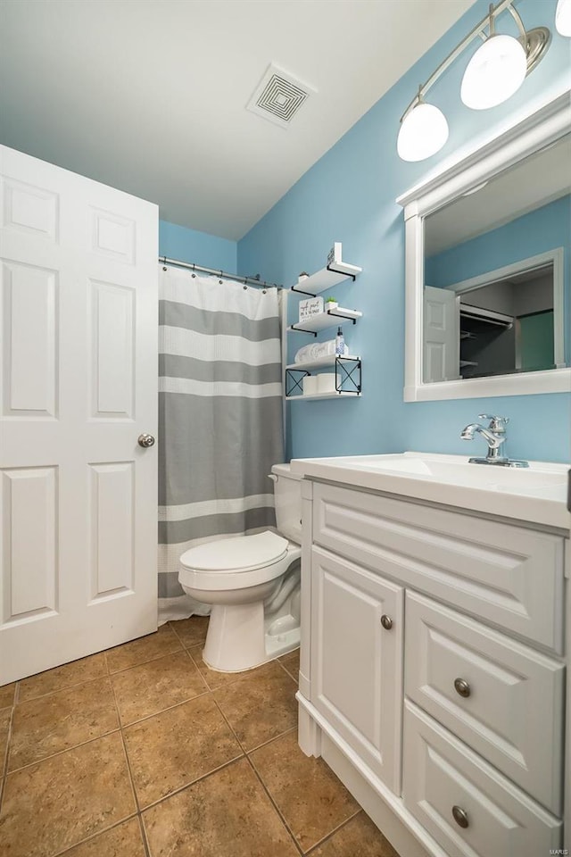 full bath featuring tile patterned flooring, visible vents, toilet, and vanity