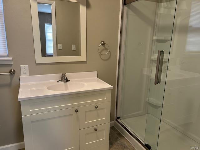 bathroom with vanity and an enclosed shower