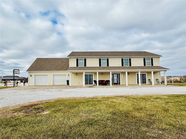 view of front of property with a front lawn and a garage