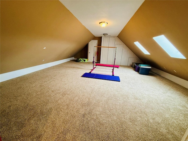 additional living space featuring carpet floors and lofted ceiling