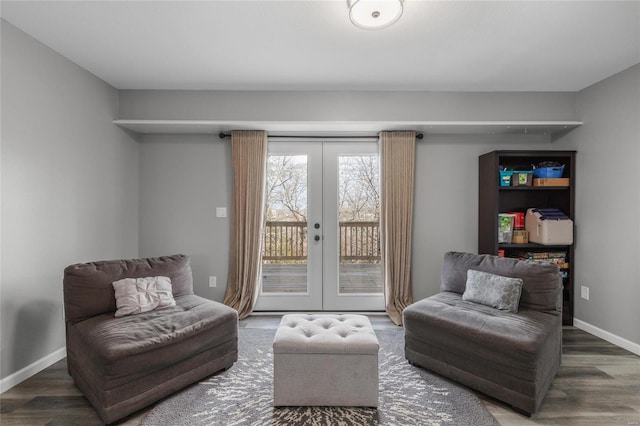 living area with french doors and hardwood / wood-style floors