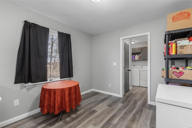 interior space with dark hardwood / wood-style flooring and washer and dryer